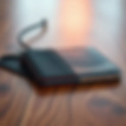 Two different hardware wallets placed side by side on a wooden table, showcasing their designs and features